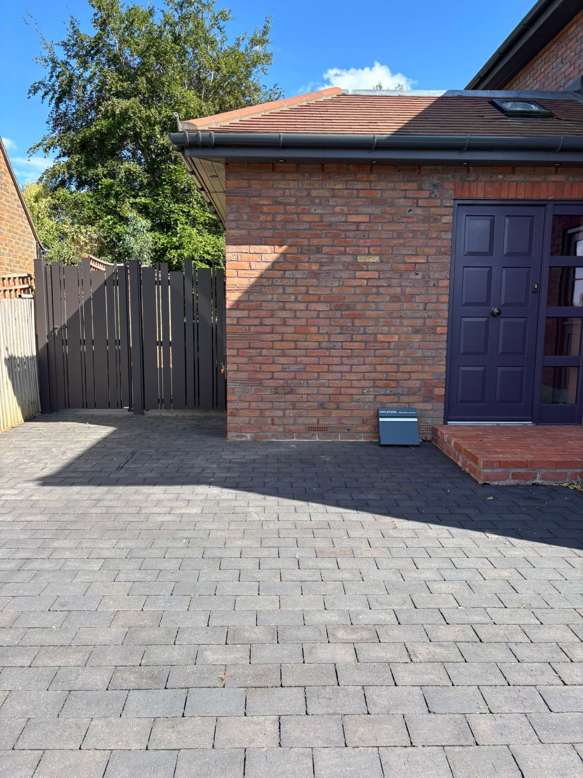 Completed brick extension and block-paved driveway