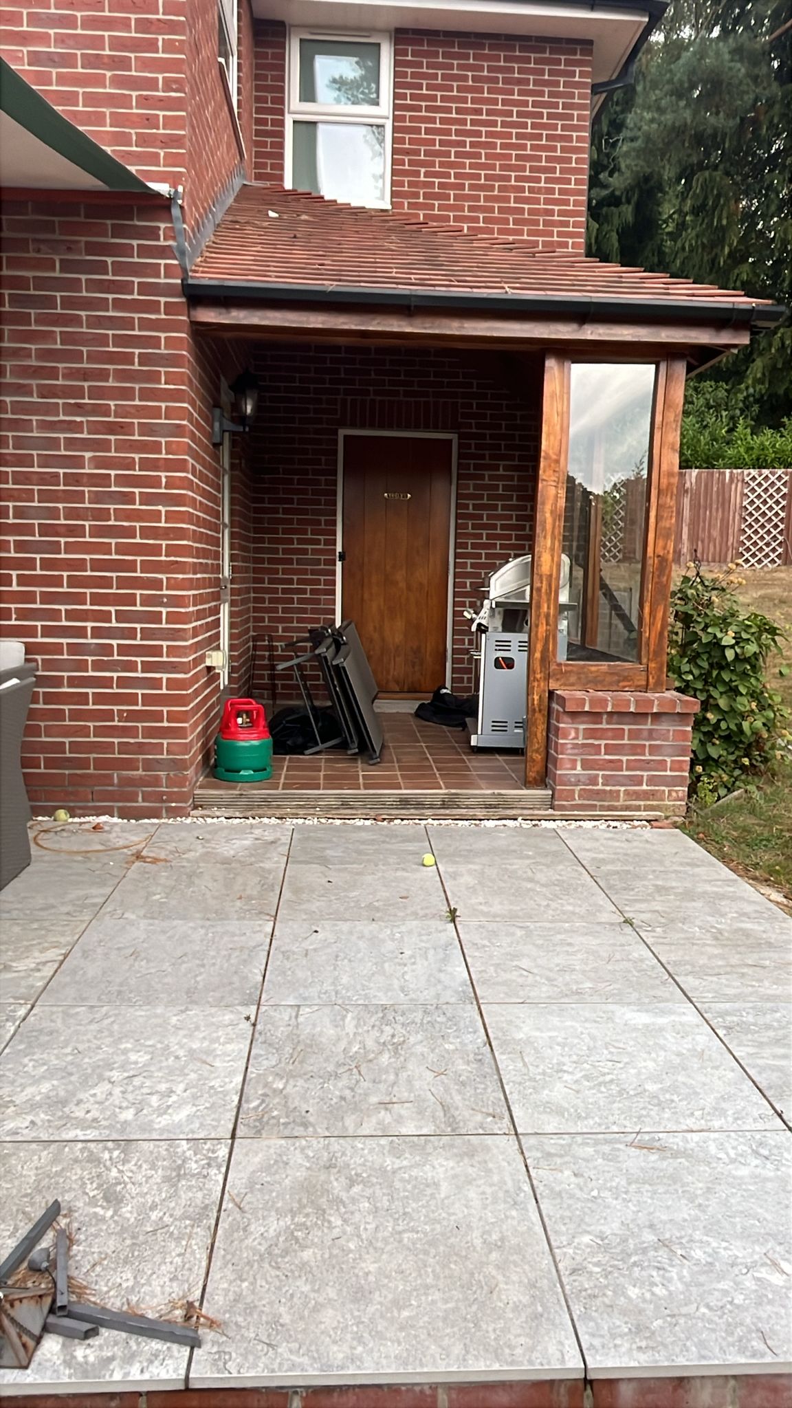 Brick house entrance and newly laid patio